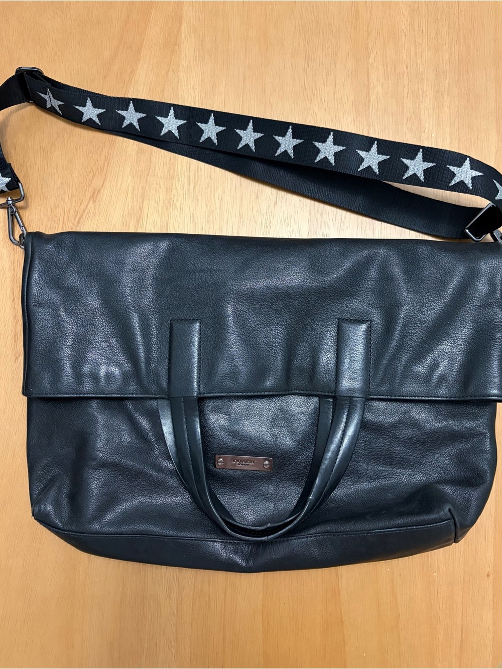 Coach Black Leather Messenger Bag with Detachable Star Accent Strap